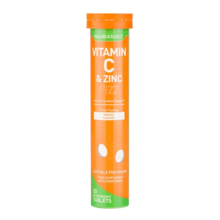 HOLLAND & BARRETT Vitamin C & Zink Brausetabletten in Orangegeschmack, 20 Stück, auf einer weißen Oberfläche.