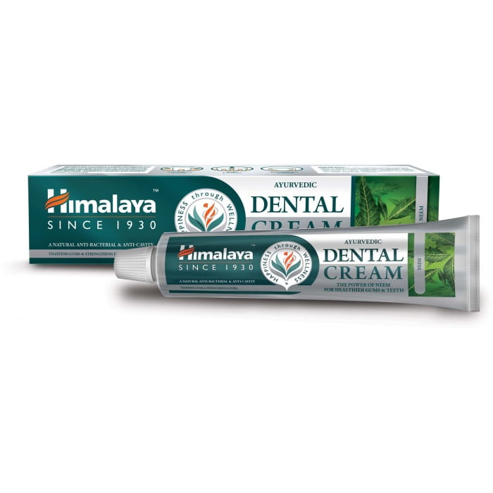 Naturgetreue Aufnahme der Himalaya ayurvedischen Neem-Zahnpasta in 100 g, mit natürlicher Verpackung und Zahncreme-Text.