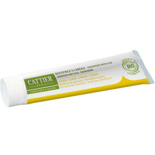 Natürliche CATTIER Zahnpasta mit Tonerde und Zitronenöl, 75 ml, remineralisierend, umgeben von Zitronen und Tonerde.