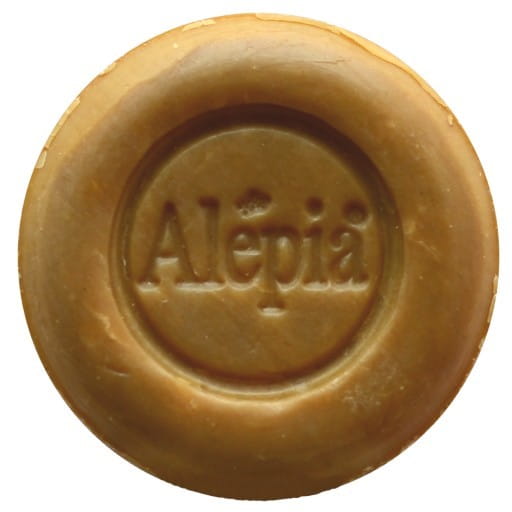 Feuchtigkeits- und beruhigende Rasierseife von ALEPIA, 60 g, cremige Textur in einer runden Verpackung.