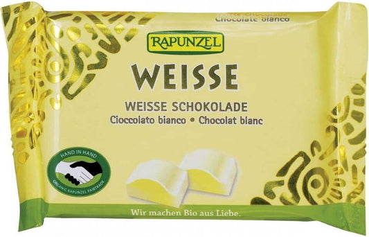 Weiße Bio-Schokolade von RAPUNZEL in 100 g Verpackung, cremige Textur und helle Farbe, ideal für Süßigkeiten und Backen.