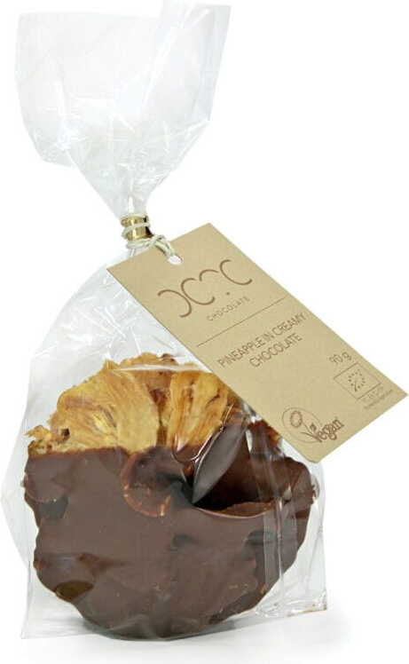 Bio Ananas in cremiger Schokolade von COCOA, 90 g, frisch und saftig, umhüllt von zarter Schokolade.